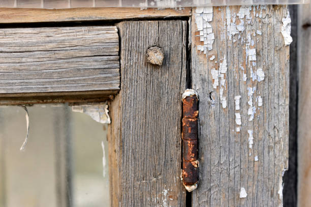 istock Old wooden painted rotten windows with glass 1357900704