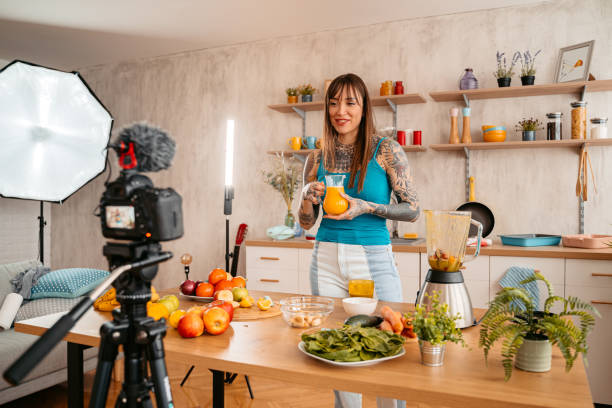 istock Woman making vlog about preparing healthy smoothie 1357901537