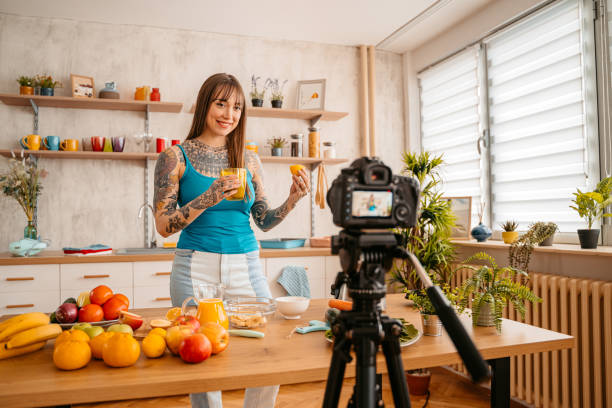 istock Woman making vlog about preparing healthy smoothie 1357901617