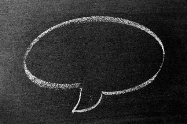 istock White color chalk hand drawing in round bubble speech shape with blank space on blackboard or chalkboard background 1357902224