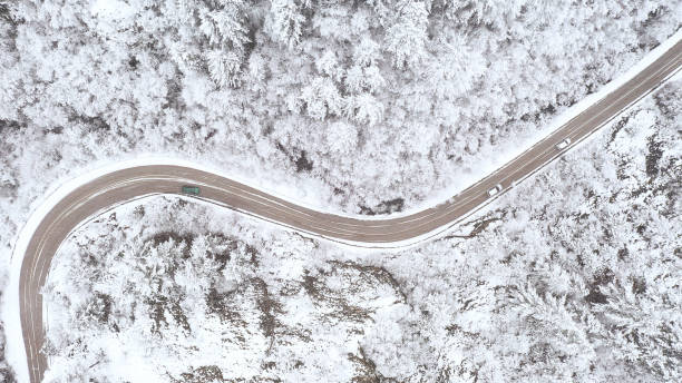 istock Car driving on winter country road 1357902975