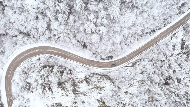 istock Car driving on winter country road 1357902983