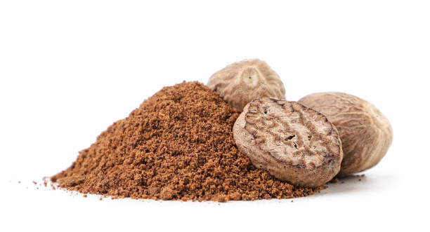 istock Whole and crushed nutmeg on a white background. Isolated 1357903199