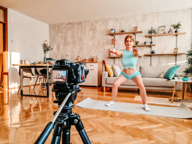istock Woman working out in front of camera for her vlog 1357903456