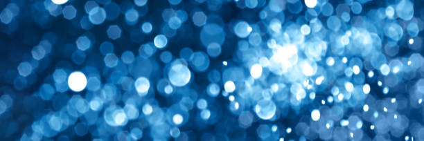 istock Blue sparkling glitter bokeh background banner 1357903652