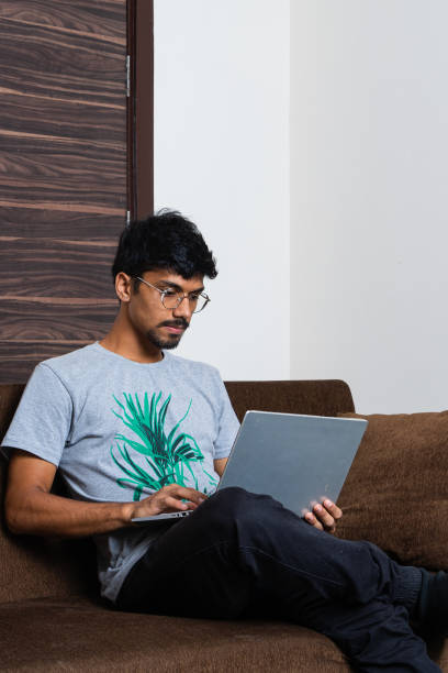 istock young Indian boy working on his laptop and work from home 1357906645