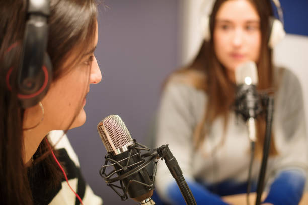 istock Two women working in a radio station 1357907737