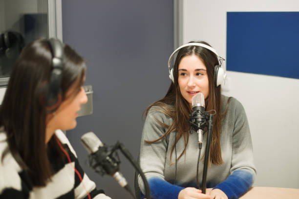 istock Two women working in a radio station 1357907793