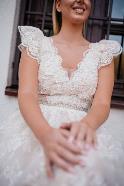 istock Bride in white wedding dress walks through autumn forest 1357908654
