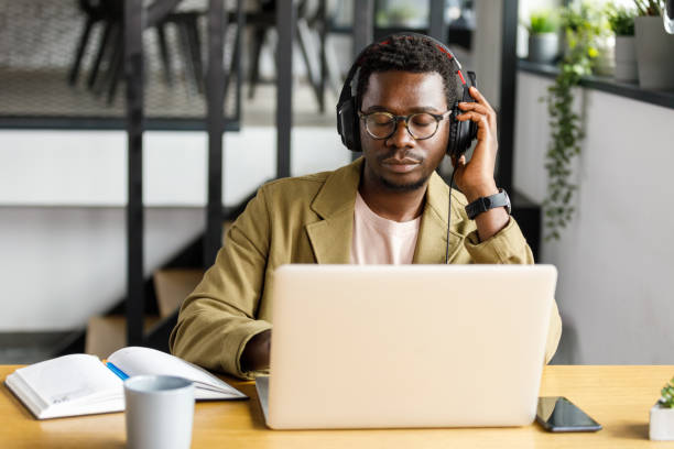 istock Feeling the music while sitting at desk and working 1357911463