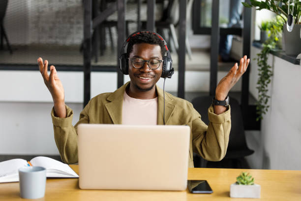 istock Cheerful businessman gesturing while explaining his project ideas to business partner via video call 1357911464