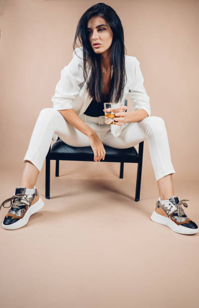 istock The model poses with a glass of drink 1357911521