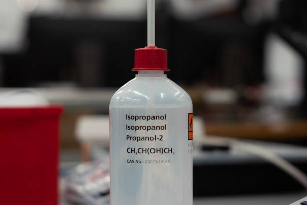 Isopropanol plastic bottle and dispenser. Close up shot in a science lab. Shallow depth of field, no people stock photo