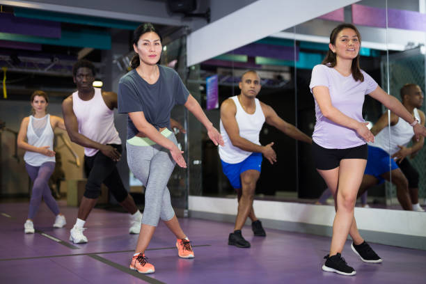 istock People dancing aerobics at lesson in gym 1357913231