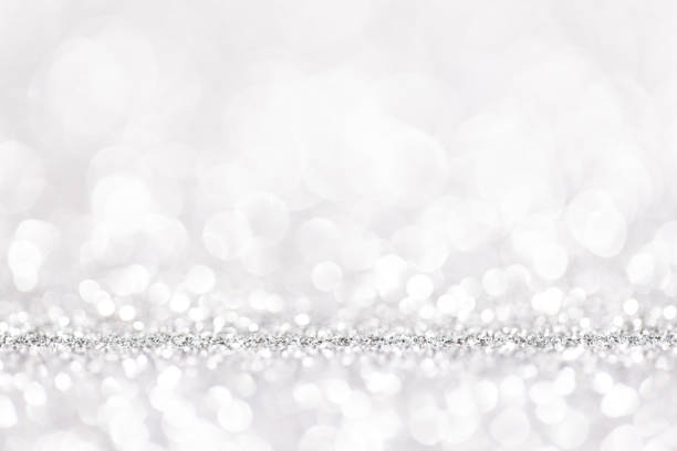 istock Bokeh gray background. Silver abstract bokeh snow falling winter christmas holiday background 1357913286