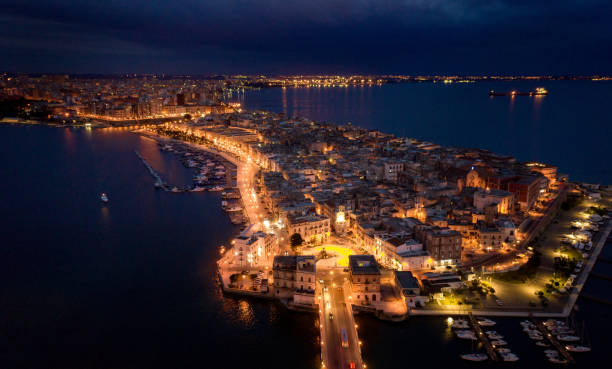 Aerial view of Taranto old city at night, Puglia. Italy Aerial view of Taranto old city at night, Puglia. Italy taranto stock pictures, royalty-free photos & images