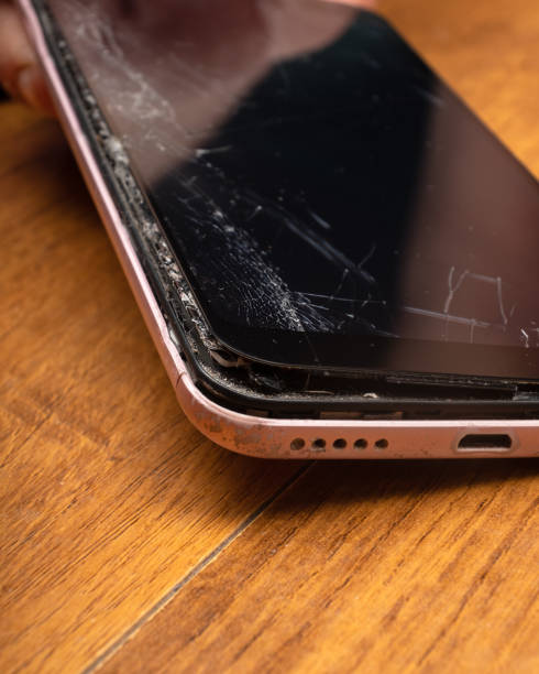 istock broken phone screen closeup, broken glass smartphone 1357914789