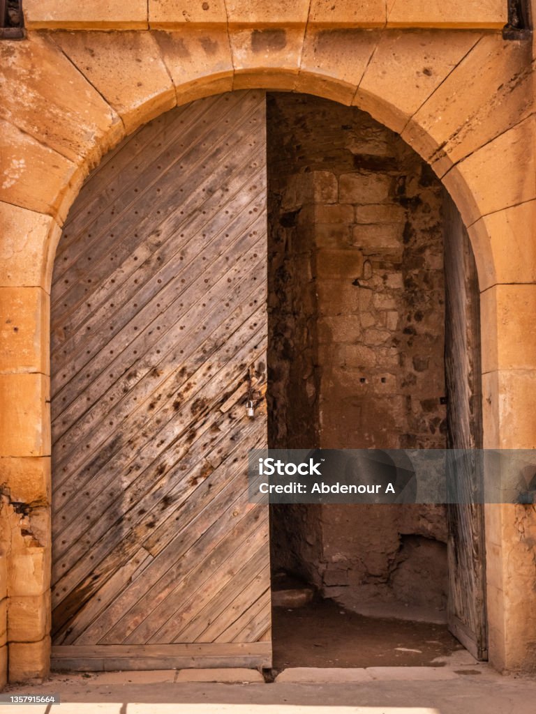 wooden door old spanish wooden door, medieval architecture , stone arch doorway Algeria Stock Photo