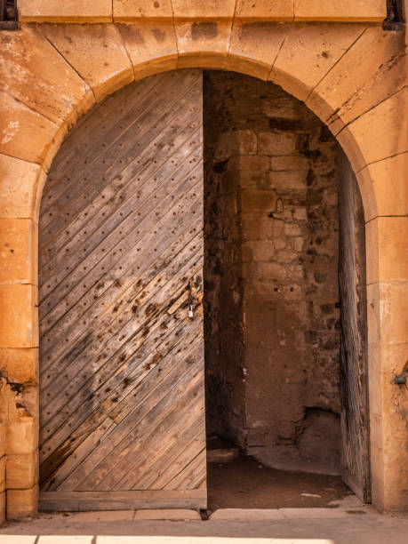 wooden door old spanish wooden door, medieval architecture , stone arch doorway oran algeria photos stock pictures, royalty-free photos & images