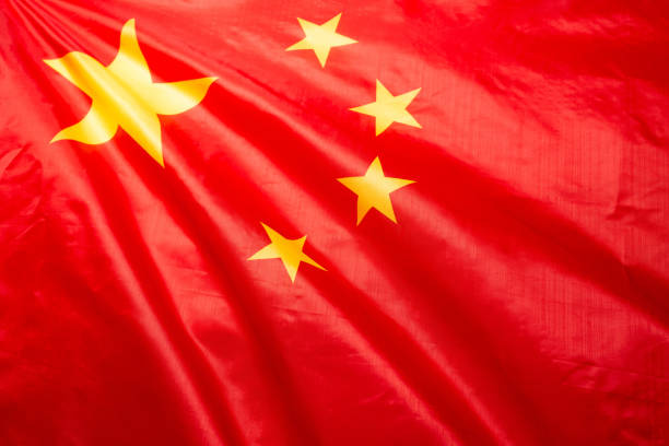 istock China flag waving as a background. 1357921394