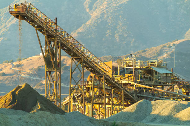 Quarry Stone Crusher and Conveyor at Sunset - fotografia de stock