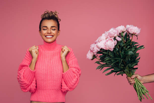 istock Young girl accepting flowers 1357923228