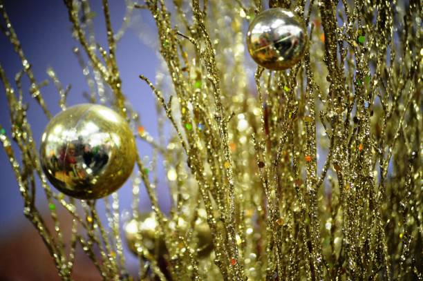 istock Branches and balls of gold color 1357923909