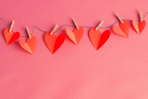 istock Paper hearts hanging on a clothesline with space for copy 1357928882