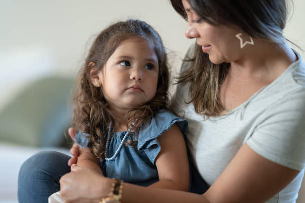 istock Mother Cuddling Her Young Toddler 1357931792