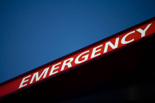 istock EMERGENCY sign, illuminated, sky, hospital, close-up 1357932534