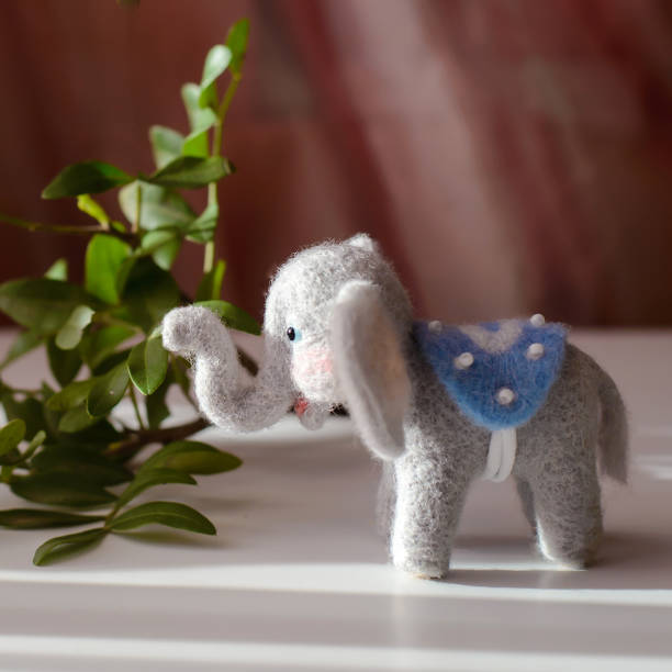 istock Cute woolly toy elephant, felting wool 1357934337