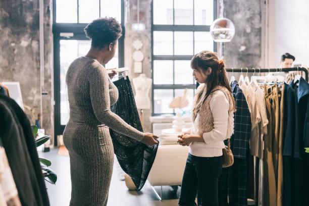 istock Friends shopping for new clothes 1357935226