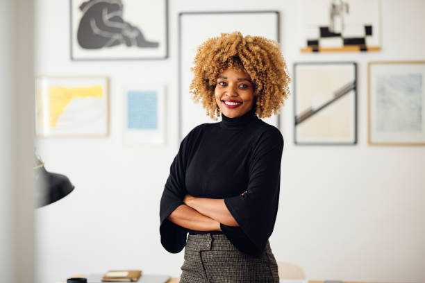 istock Confident Beautiful Woman Standing in her Home Office 1357935544