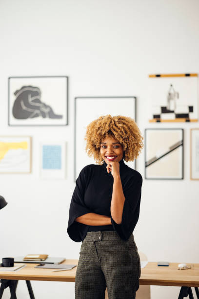 istock Confident Beautiful Woman Standing in her Home Office 1357935563