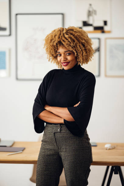istock Confident Beautiful Woman Standing in her Home Office 1357935580