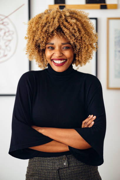 istock Confident Beautiful Woman Standing in her Home Office 1357935582