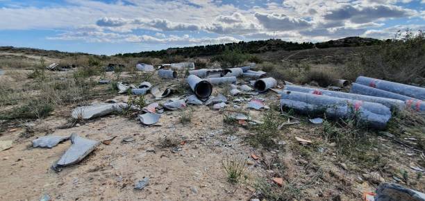 istock Illegal dumping of asbestos pipes 1357936561