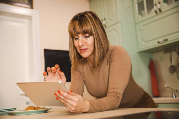 istock Woman With a Digital Tablet 1357937834