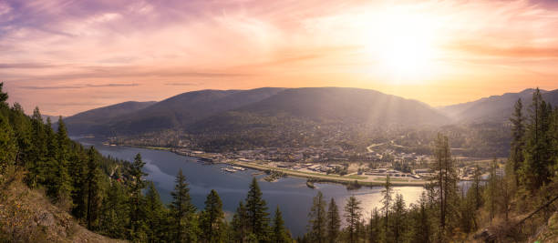 istock Panoramic View of a small Town, Nelson. Colorful Sunrise Sky Art Render. 1357938044