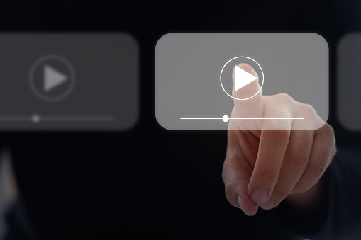 Video Marketing Concept.Hand pressing transparent button