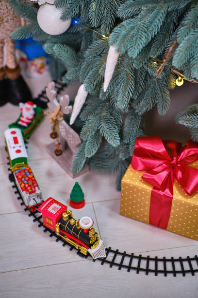 istock A Toy Train Set on the railroad under the Christmas tree 1357942089