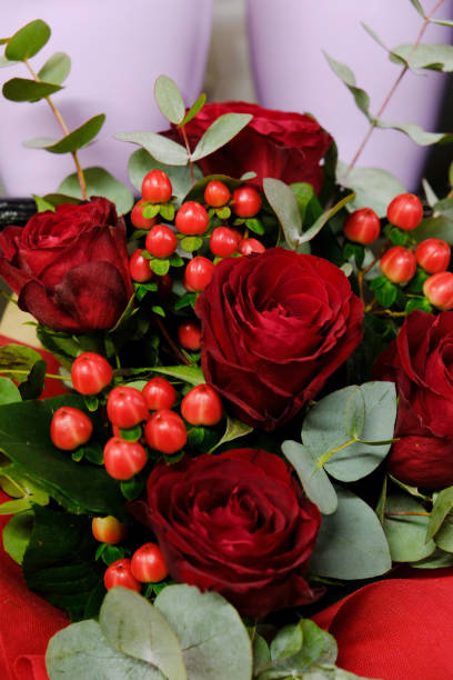 istock Beautiful red roses bouquet arrangement closeup 1357944933