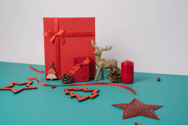 istock Christmas presents arranged on a turquoise background. 1357945055