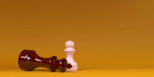 istock Side view on bright overtrown king by pink pawn chess figure with copy space 1357945932