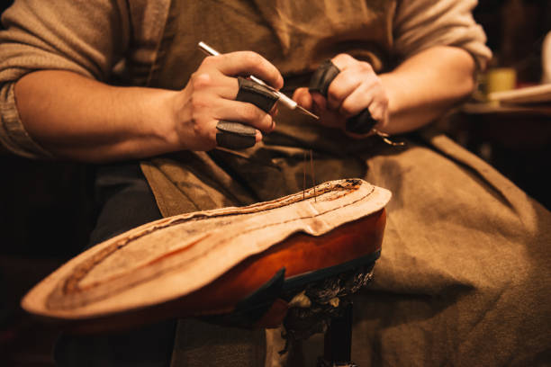 istock Cropped photo of young man shoemaker 1357946130
