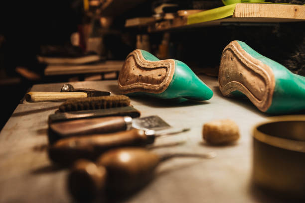istock Shoes and instruments on table at footwear workshop. 1357946257