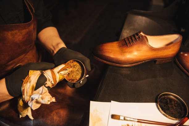 istock Cropped image of young concentrated man shoemaker 1357946477