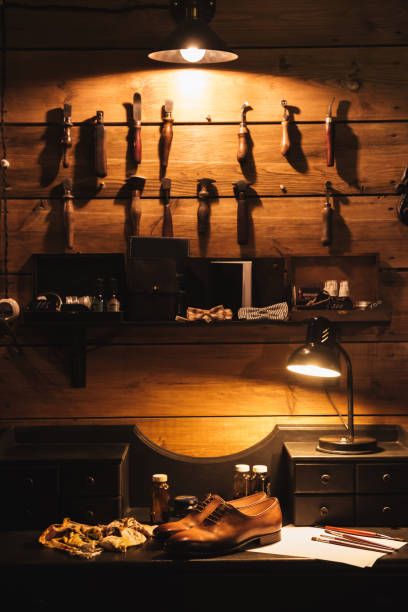 Shoes on table at footwear workshop. Image of shoes on table at footwear workshop. diy table legs stock pictures, royalty-free photos & images