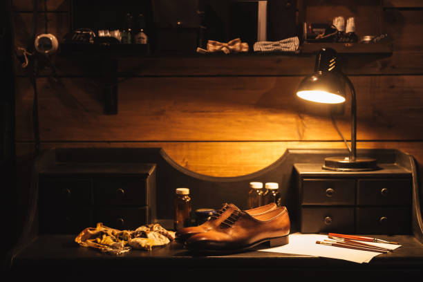 istock Shoes on table at footwear workshop. 1357947057