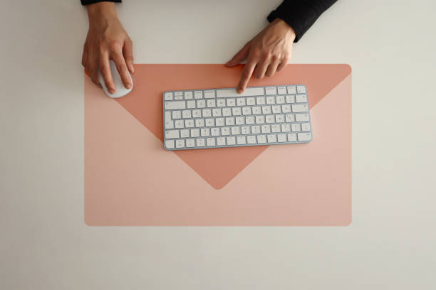 istock Email marketing and newsletter concept. Woman using computer keyboard with envelope icon 1357947304
